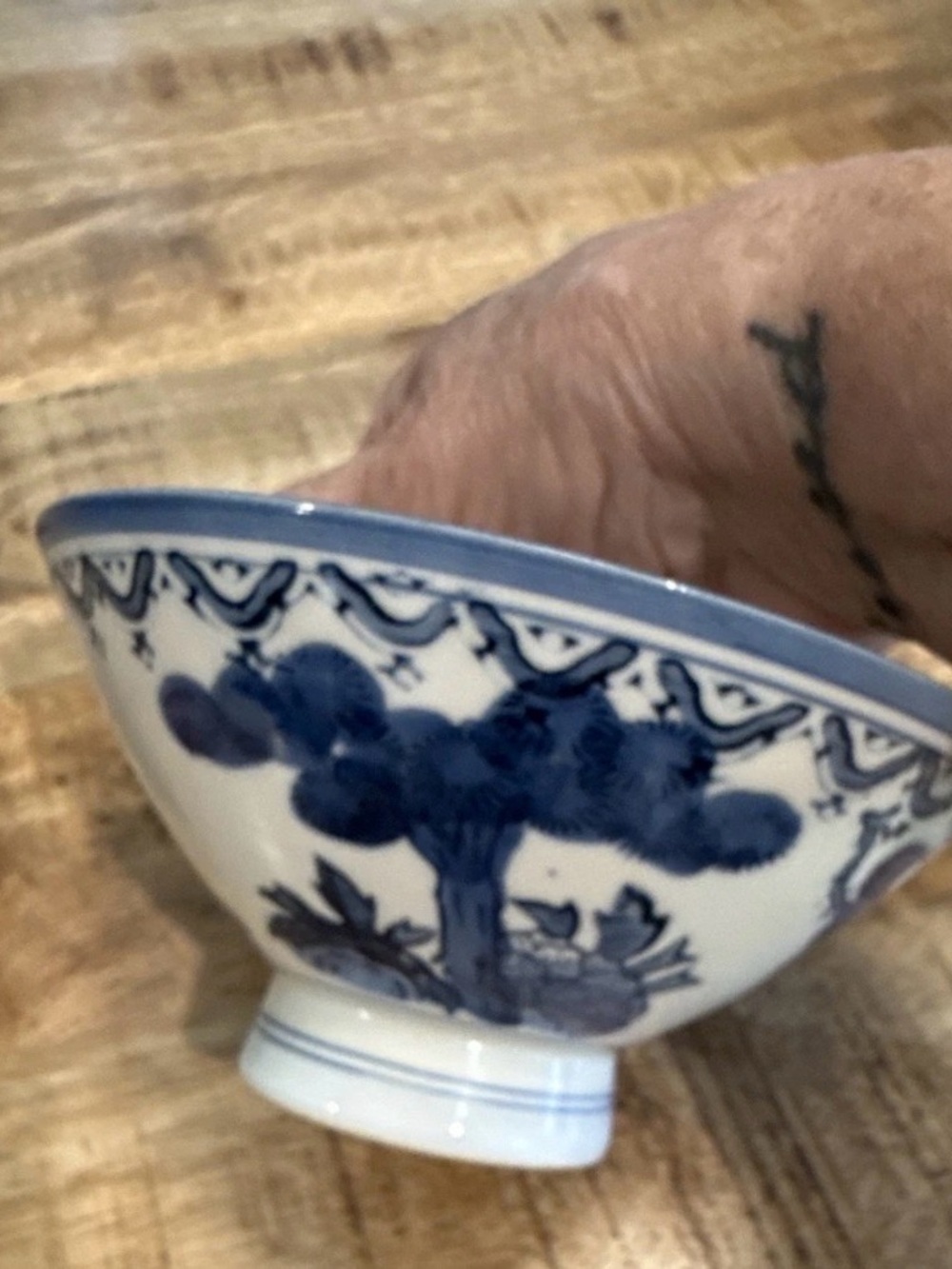 Blue and White Ceramic Decorative Bowl with Floral Motif